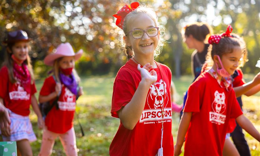 Students wearing western wear walk to school